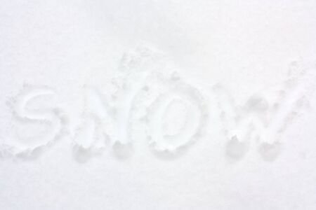 The word "snow" written in snow.の写真素材