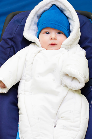 Cute baby dressed in warm fluffy winter clothes.の写真素材