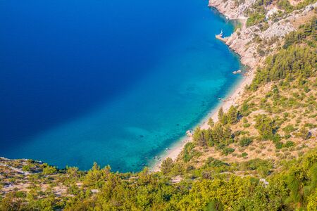 Bay foot of the mountain (Biokovo), turquoise sea. Beach, Makarska riviera, Croatiaの写真素材
