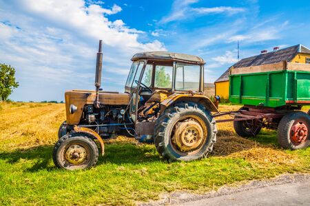Very old tractor in the field.の写真素材