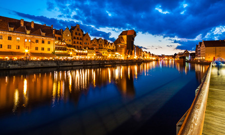 Gdansk at night with reflection in Motlawa river, Polandの写真素材