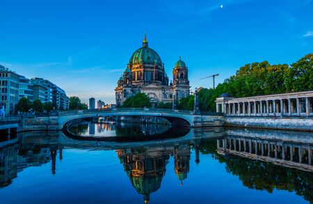 Berlin Cathedral (Berliner Dom) reflected in Spree River at dawn, Germanyの写真素材