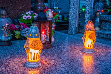 Colorful candles on the cemetery at All Saints Day, Polandの写真素材