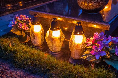 Colorful candles on the cemetery at All Saints Day, Polandの写真素材