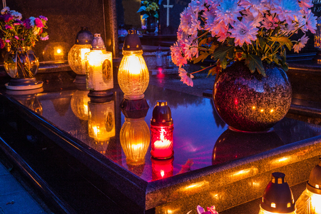 Colorful candles on the cemetery at All Saints Day, Polandの写真素材