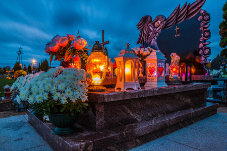 Colorful candles on the cemetery at All Saints Day, Polandの写真素材