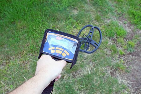 Search for treasure using a metal detectorの写真素材