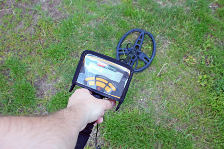 Search for treasure using a metal detectorの写真素材