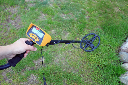 Search for treasure using a metal detectorの写真素材