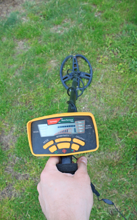 Search for treasure using a metal detectorの写真素材