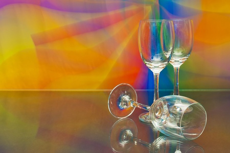 empty wine glass against colourful background