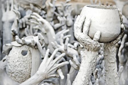 Hands statue from hell in Wat Rong Khun, Chiang Rai province, northern Thailand の写真素材