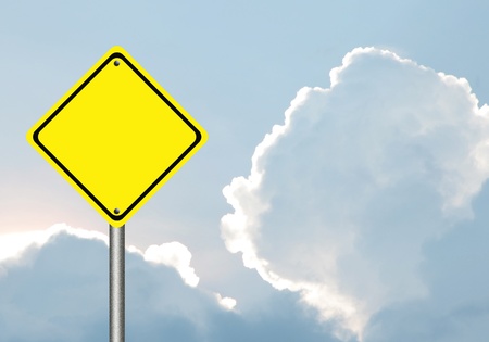 Blank  yellow traffic sign  with blue skyの写真素材