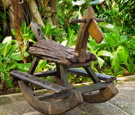Old wooden rocking horse  in the parkの写真素材
