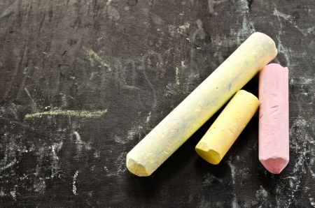 Close-up of colorful chalks on blackboardの写真素材