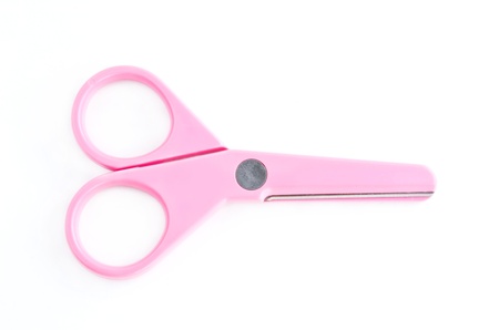 Pink scissors isolated on white background