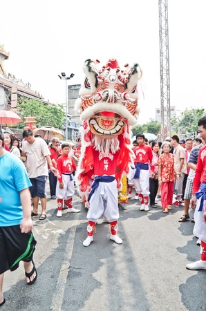 BANGKOK, THAILAND - FEBRUARY 10  Unidentified people celebrate with chinese lion at Yaowarat Road in Chinatown district during the Chinese New Year celebrations on February 10, 2013 in Bangkok, Thailandのeditorial素材
