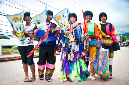 LOEI , Thailand - JULY  2011   An unidentified  children  aged  11-14 years wear ghost costumes at Ghost Festival  Phi Ta Khon - a masked procession celebrated by Buddhist   on July 02, 2011 in Loei Province, Thailand のeditorial素材