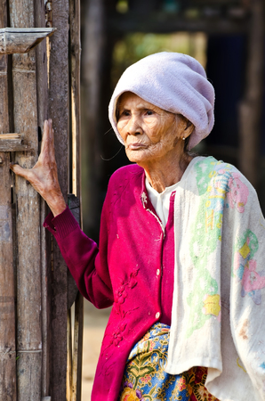 KANCHANABURI THAILAND-January 29  An unidentified old Mon ethnic woman poses for the photo at her house on January 29, 2012  at KANCHANABURI THAILAND  Mon are an ethnic group spread in Thailand のeditorial素材