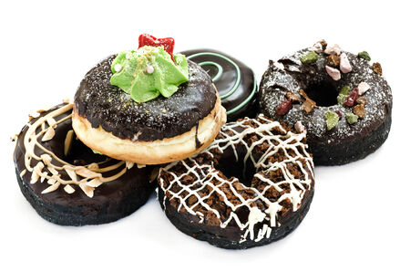 Baked fancy donuts isolated on white.の写真素材