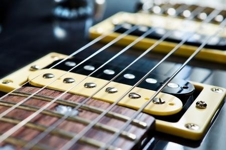 Detail of six-string electric guitar closeup, selective focus の写真素材
