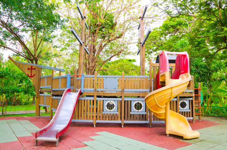 Children playground equipment in the form of pirate ship at the park の写真素材