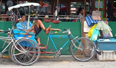 CHIANGMAI, THAILAND - JULY 29: Tricycle bicycle taxi parking at the street for customers  on July 29, 2014  in Chiang Mai,Thailand. Tricycle bicycle taxi is one of the public transport in Thailand.のeditorial素材