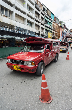 CHIANGMAI, THAILAND - JULY 29: Red car taxi run through the streets  looking for customers on July 29, 2014  in Chiang Mai,Thailand. Red car is the most common form of public transport in the city.のeditorial素材