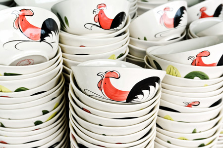 Ceramic rooster bowl from Lampang on sell in local market,Thailandの写真素材