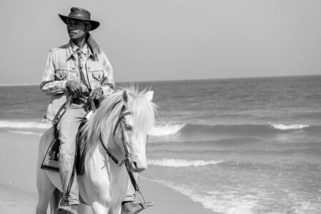 PHETCHABURI  THAILAND  JANUARY 3: An unidentified people riding on horse back at Cha  am beach  on January 3 2015 in Petchaburi Thailand. Cha  am beach is the famous seaside resort in Thailand.のeditorial素材