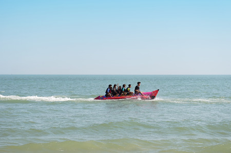 PHETCHABURI, THAILAND - JANUARY 3: Tourists enjoying ride Banana Boat adventure at Cha - am on January 3, 2015 in Petchaburi, Thailand. Cha - am beach is the famous seaside resort in Thailand.のeditorial素材