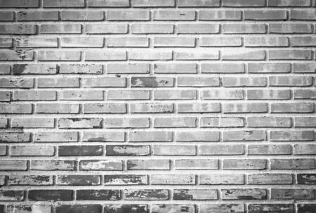 Monochrome shot of old brick wall texture, can be used for backgroundの写真素材