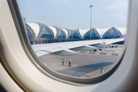 BANGKOK - APRIL 22: Suvarnabhumi Airport  is one of two international airports serving Bangkok on April 22, 2016 in Bangkok ,Thailand. View through the window.のeditorial素材