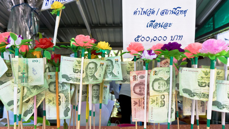 NONTHABURI THAILAND-APRIL13: Donation Merit Money Banknotes on color stick donated by visitors for maintenance the temple on April 13, 2017 in Nonthaburi,Thailand.のeditorial素材