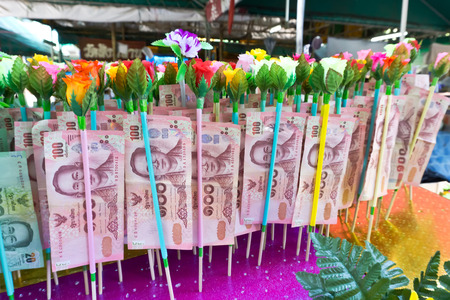 NONTHABURI THAILAND-APRIL13: Donation Merit Money Banknotes on color stick donated by visitors for maintenance the temple on April 13, 2017 in Nonthaburi,Thailand.のeditorial素材