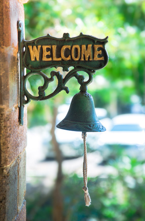 welcome tag with old bell of the house in Thailandの写真素材