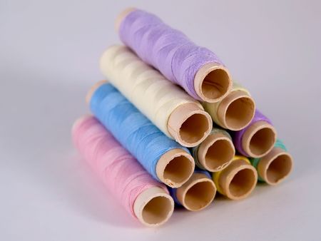 Different color sewing thread on light backgroundの写真素材