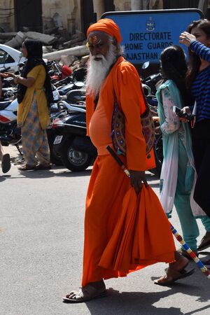 Sadhu walking down the street in Jaipur, Rajasthan, Indiaのeditorial素材