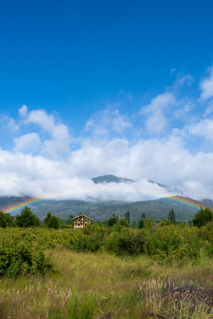 Rainbow under blue skyの写真素材