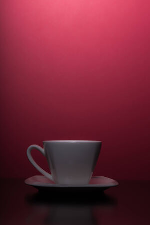 cup of tea with red backgroundの写真素材