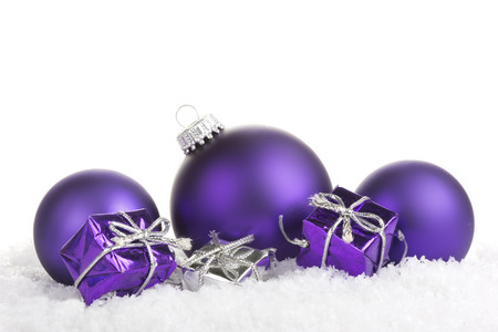 Christmas balls purple with presents on white backgroundの写真素材