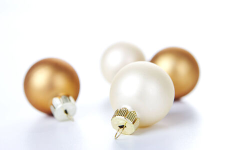 Christmas balls white and brown on white backgroundの写真素材