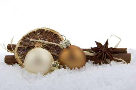 Christmas decoration, balls on artificial snow with white backgroundの写真素材