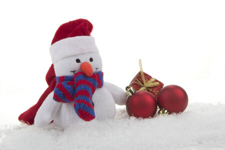 snow man  toy  with christmas decoration and artificial snowの写真素材