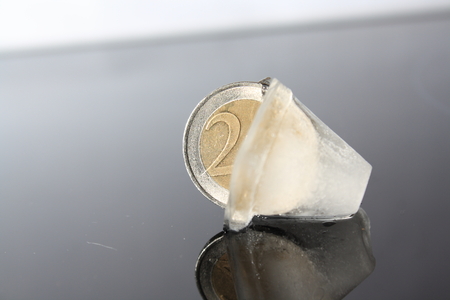 Ice Cube with Euro Coinの写真素材