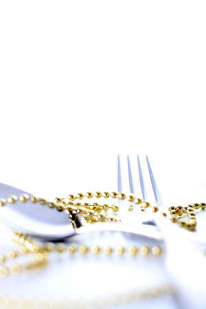 Cutlery, spoon and fork with decoration and white backgroundの写真素材