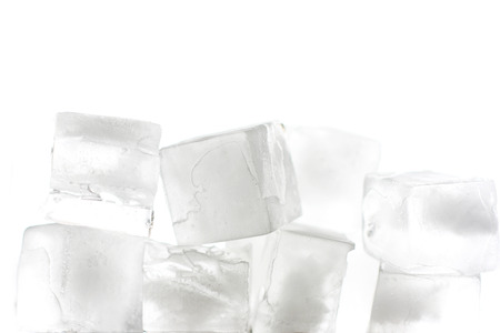 several ice cubes in the form of ground with white backgroundの写真素材