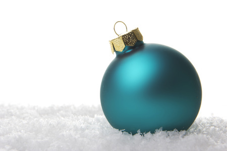 green christmas bauble isolated with white backgroundの写真素材
