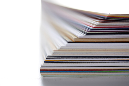 separating stacked sheets to organize a folder の写真素材