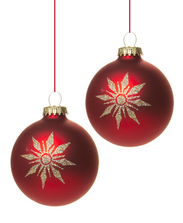 red christmas baubles with white pattern, star の写真素材